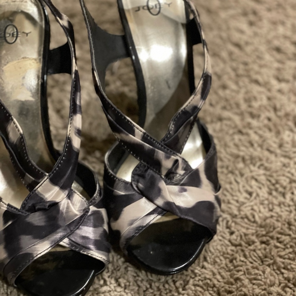 Black and white strappy heel worn about 10 to 15 times